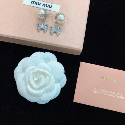 MIUMIU 26S PEARL BOW DROP EARRINGS WITH CRYSTALS IN SILVER TONE METAL 633769