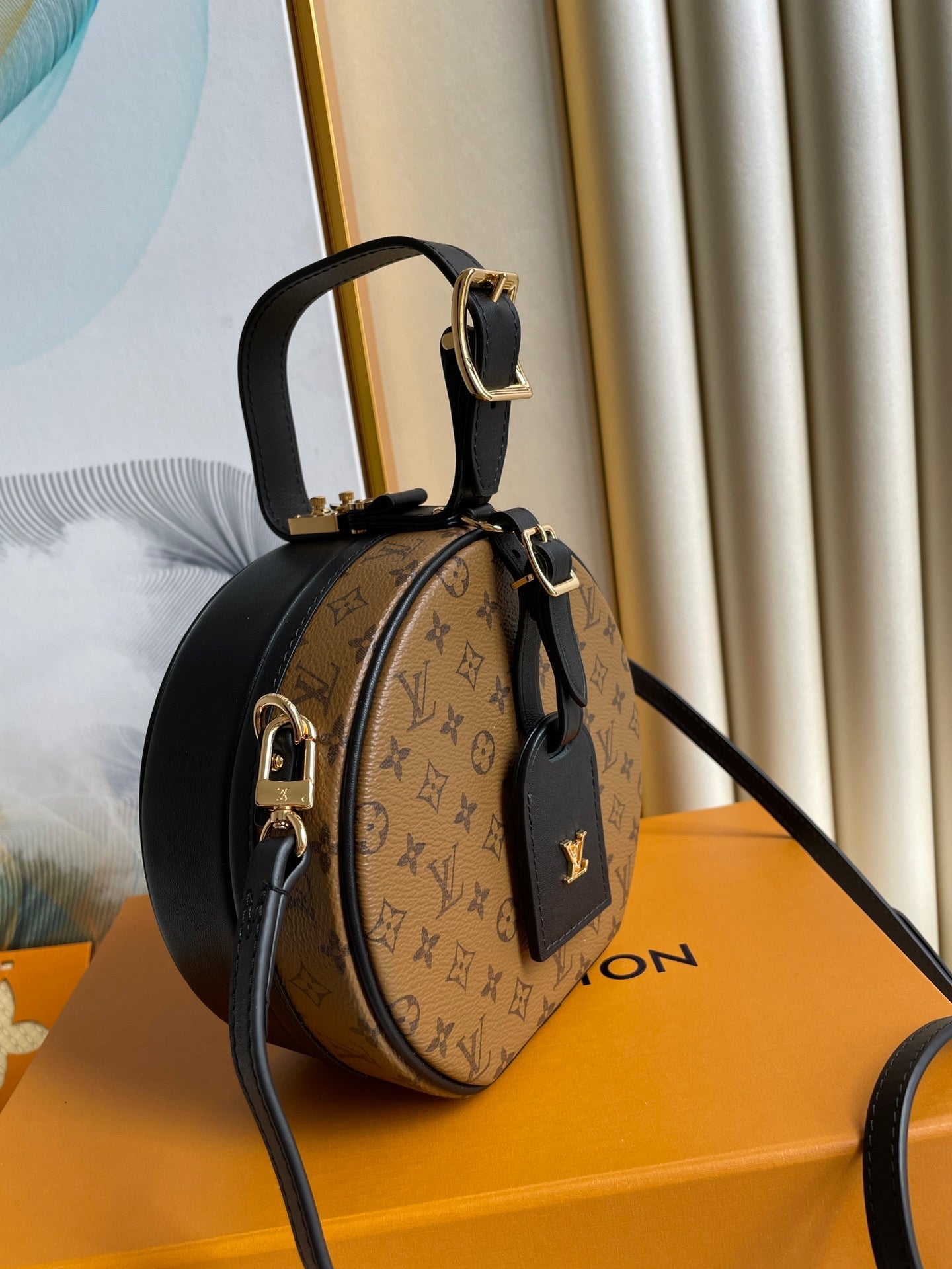 LV 25S PETITE BOITE CHAPEAU 17 IN BLACK MONOGRAM REVERSE CALFSKIN