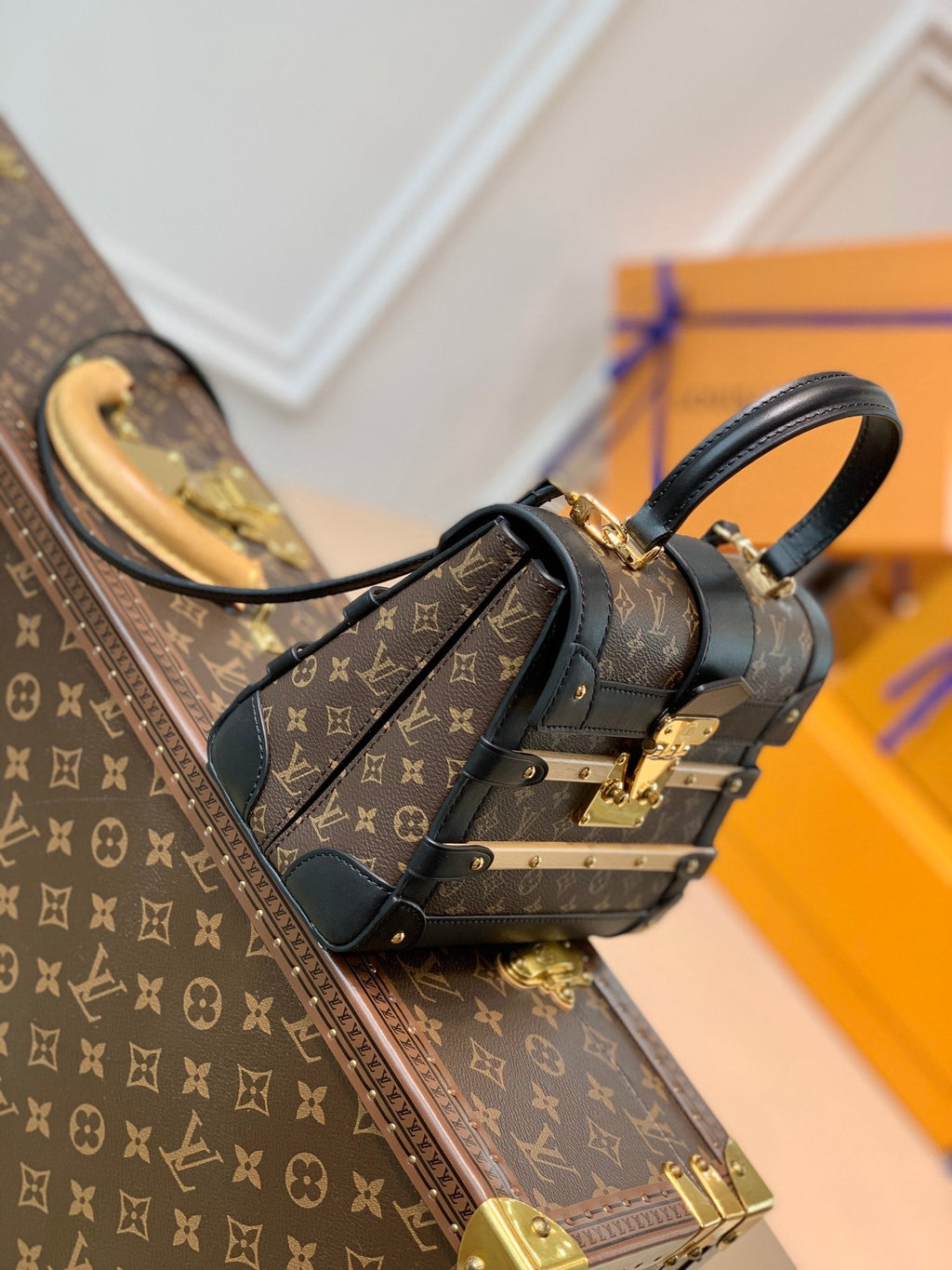TRIANON PM 21 IN BROWN MONOGRAM COATED CANVAS AND BLACK CALFSKIN SIGNATURE S-LOCK
