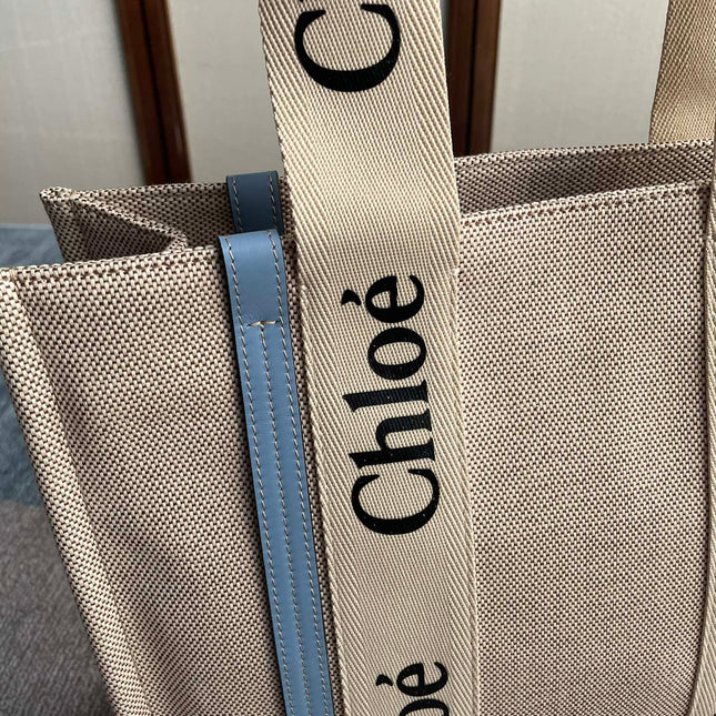 MEDIUM STRAP WOODY TOTE BAG 37 IN BEIGE LINEN CANVAS BLACK WEBBING LOGO EMBROIDER BLUE CALFSKIN