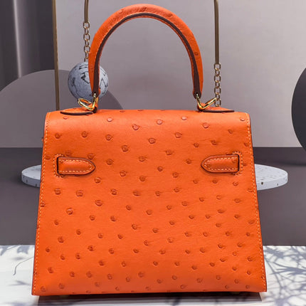 KELLY BAG 20 IN FIRE ORANGE OSTRICH LEATHER WITH GOLD HARDWARE
