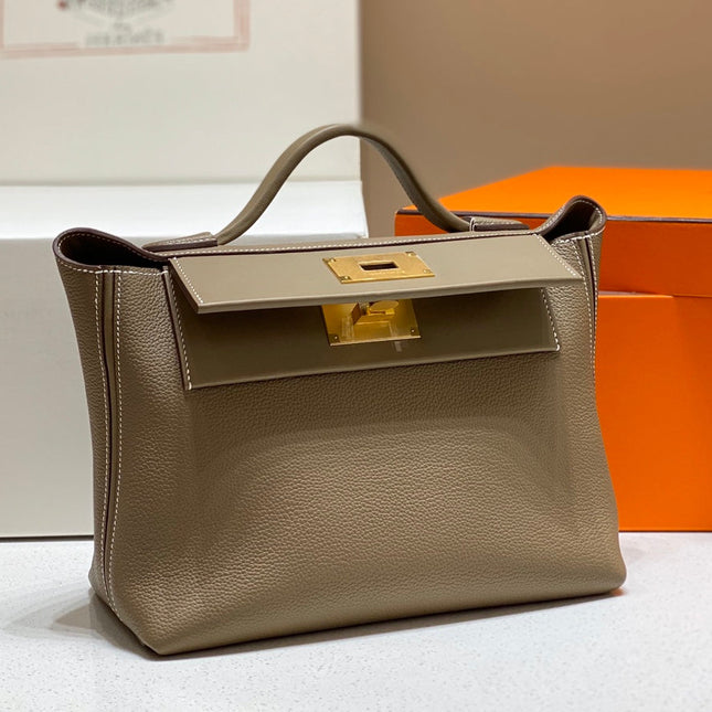 HM 26S 24/24 29MM IN BROWN EVERCOLOR CALFSKIN GOLD KELLY BUCKLE
