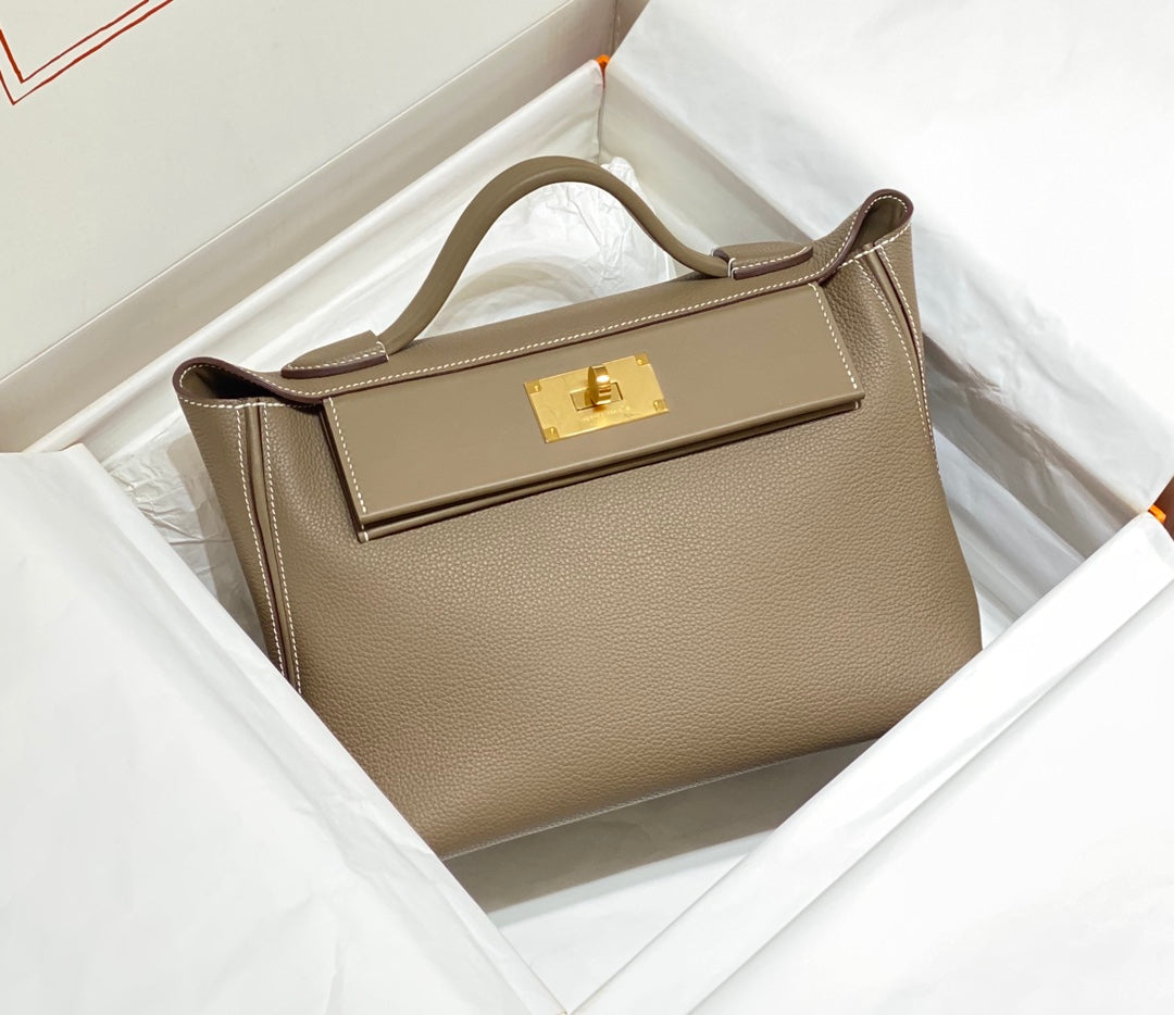 HM 26S 24/24 29MM IN BROWN EVERCOLOR CALFSKIN GOLD KELLY BUCKLE