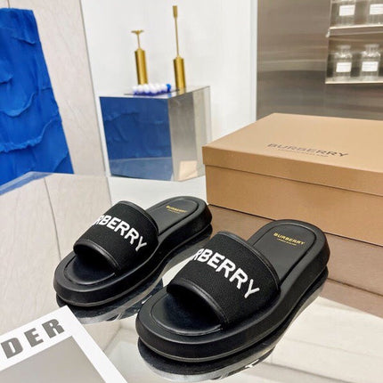 BURBERRY 26S SLIDE SANDALS IN BLACK CALFSKIN AND FABRIC