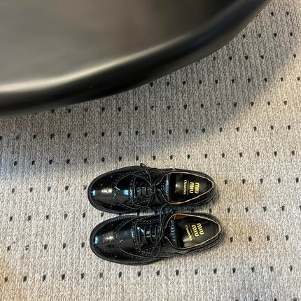 MIUMIU 26S LACE-UP BROGUE LOAFERS IN BLACK PATENT CALFSKIN
