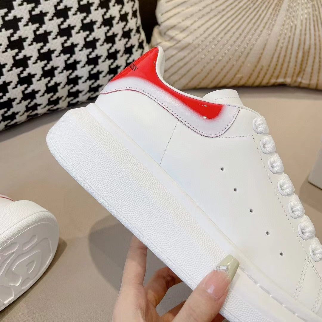 OVERSIZED SNEAKER IN WHITE CALFSKIN WITH GLOSSY RED AND WHITE HEEL TAB