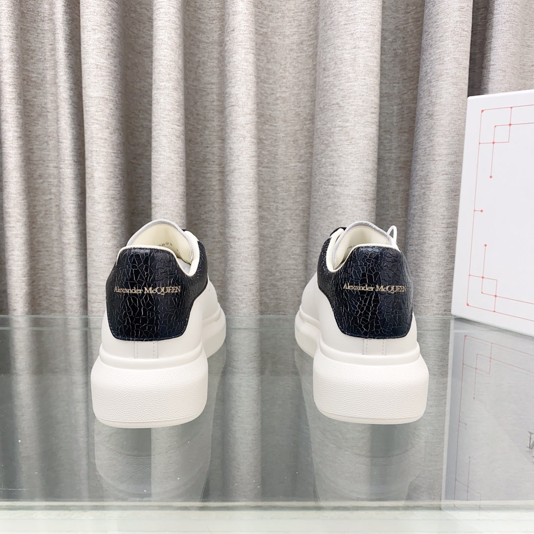OVERSIZED SNEAKERS IN WHITE CALFSKIN WITH BLACK HEEL TAB