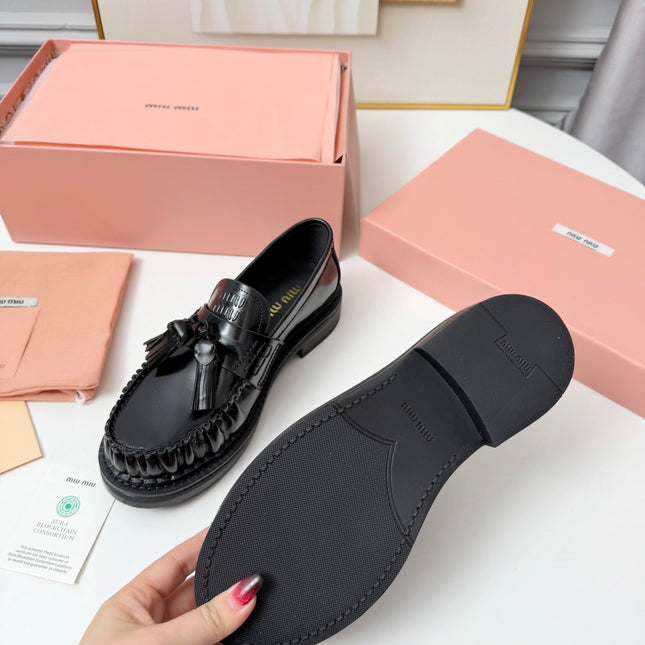 MIUMIU 26S TASSEL LOAFERS IN BLACK CALFSKIN