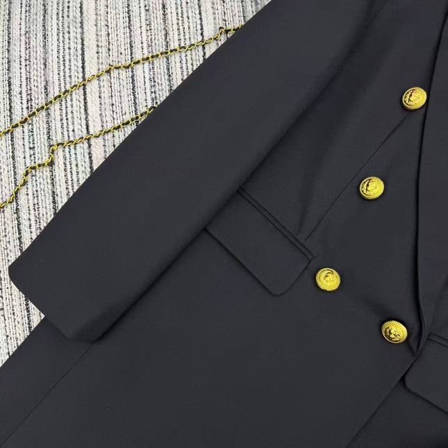 LONG COAT IN BLACK WITH GOLD BUTTONS AND A SNAKE BROOCH