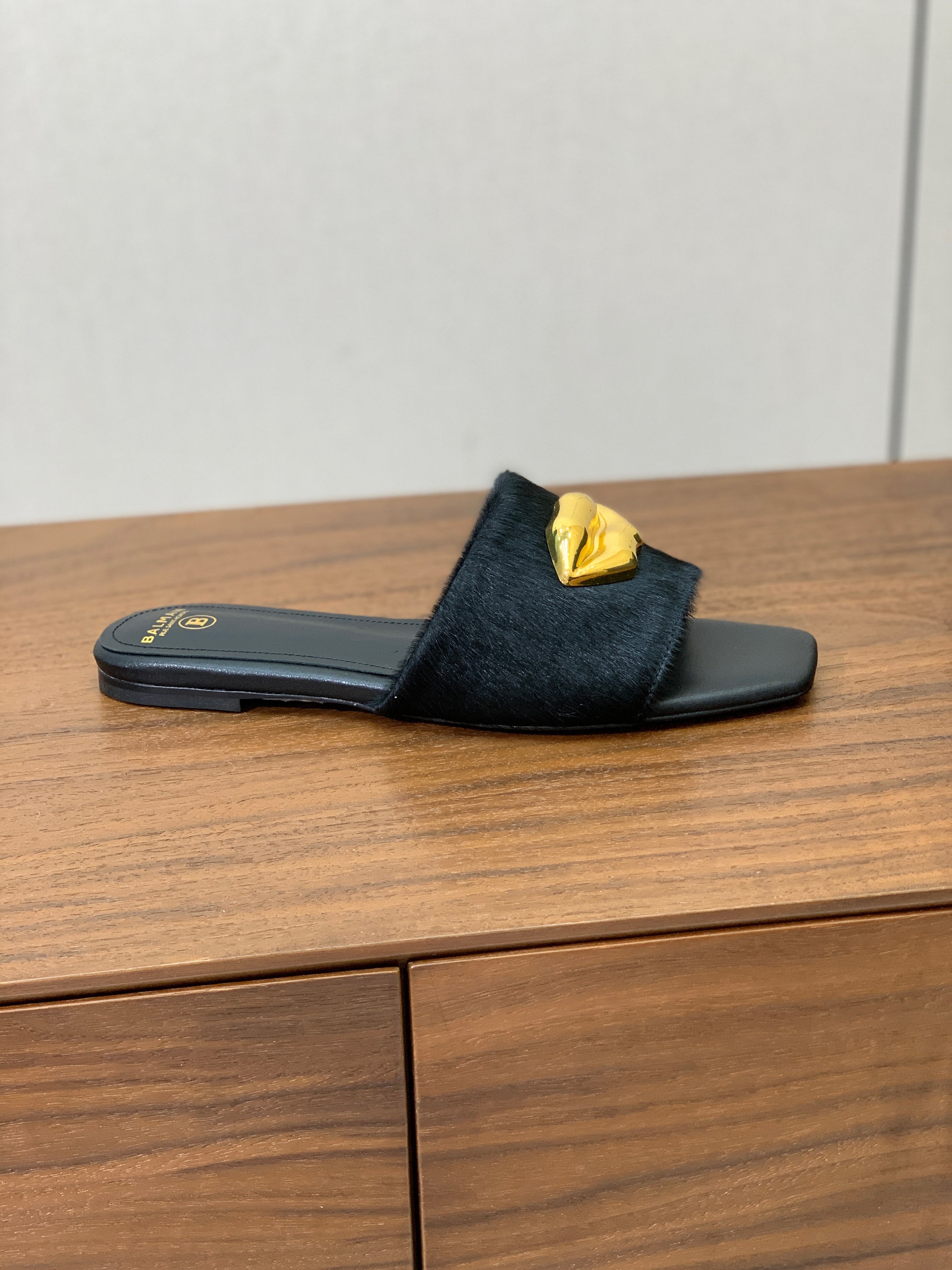 BALMAIN 26S LIP-EMBELLISHED SLIDES IN BLACK PONY HAIR WITH GOLD HARDWARE