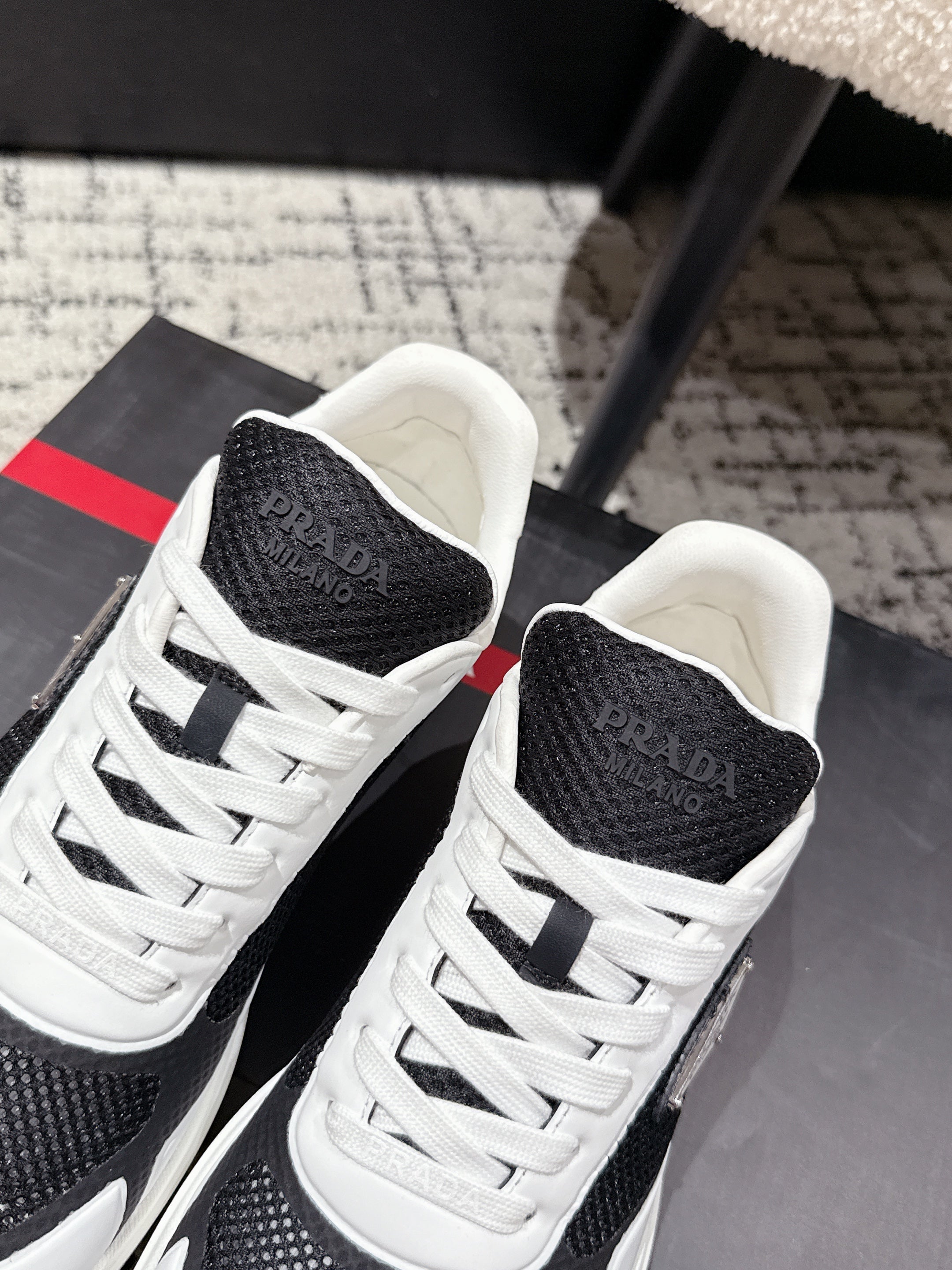 PRADA 25S MEN SNEAKERS IN BLACK AND WHITE CANVAS