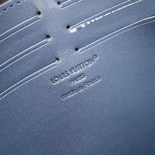 POCHETTE VOYAGE 27 IN DARK BLUE MONOGRAM ECLIPSE CALFSKIN EMBOSSED LOGO