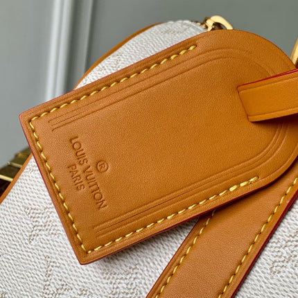 KEEPALL BANDOULIÈRE 25 IN WHITE MONOGRAM HERITAGE CANVAS BRWON CALFSKIN