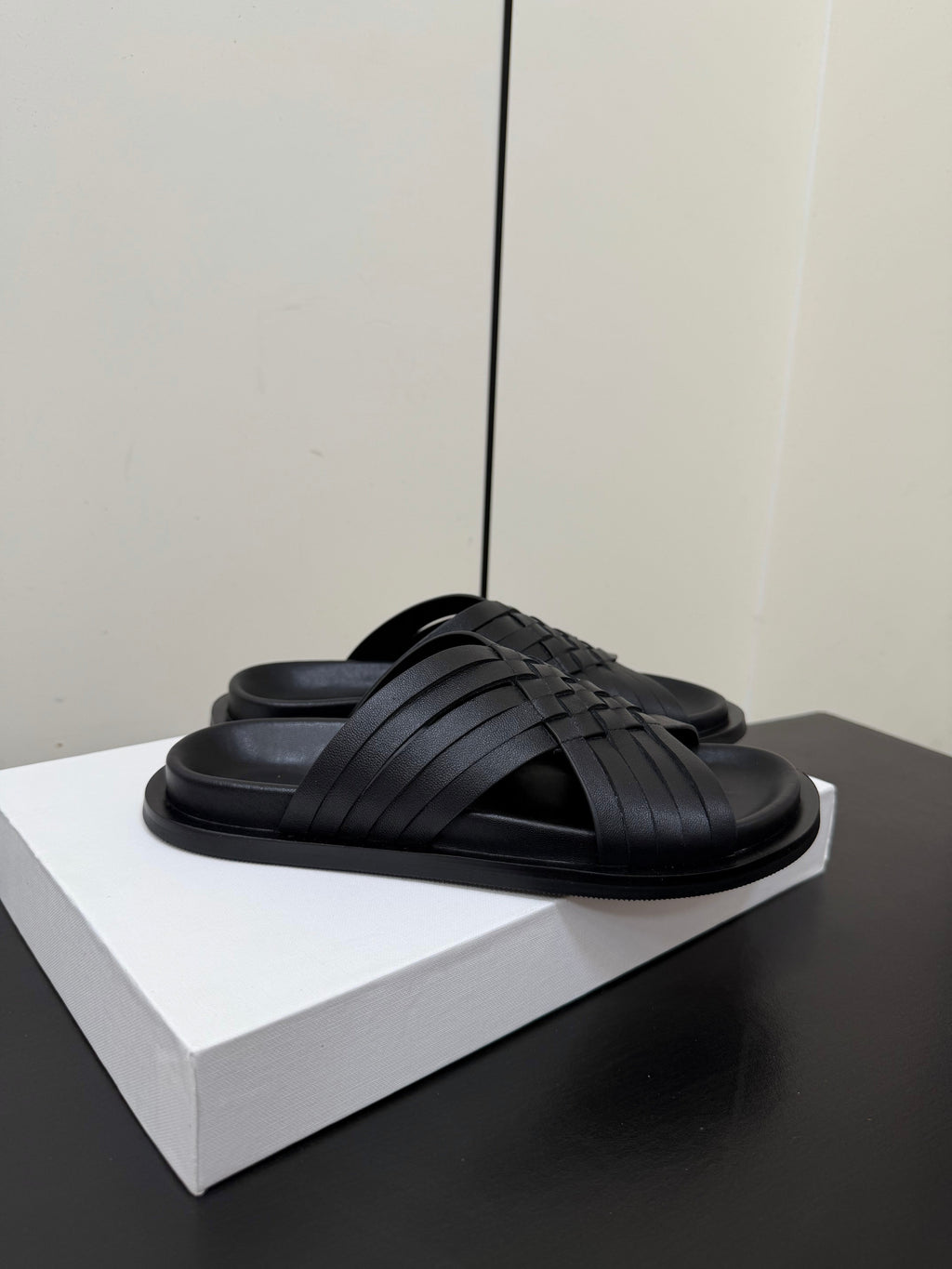 THE ROW 26S CROSS STRAP SANDALS IN BLACK CALFSKIN