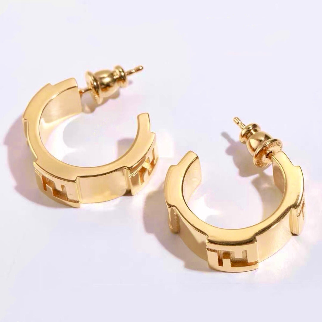 FENDI 26S FF LOGO HUGGIE HOOP EARRINGS IN GOLD TONE METAL 635065