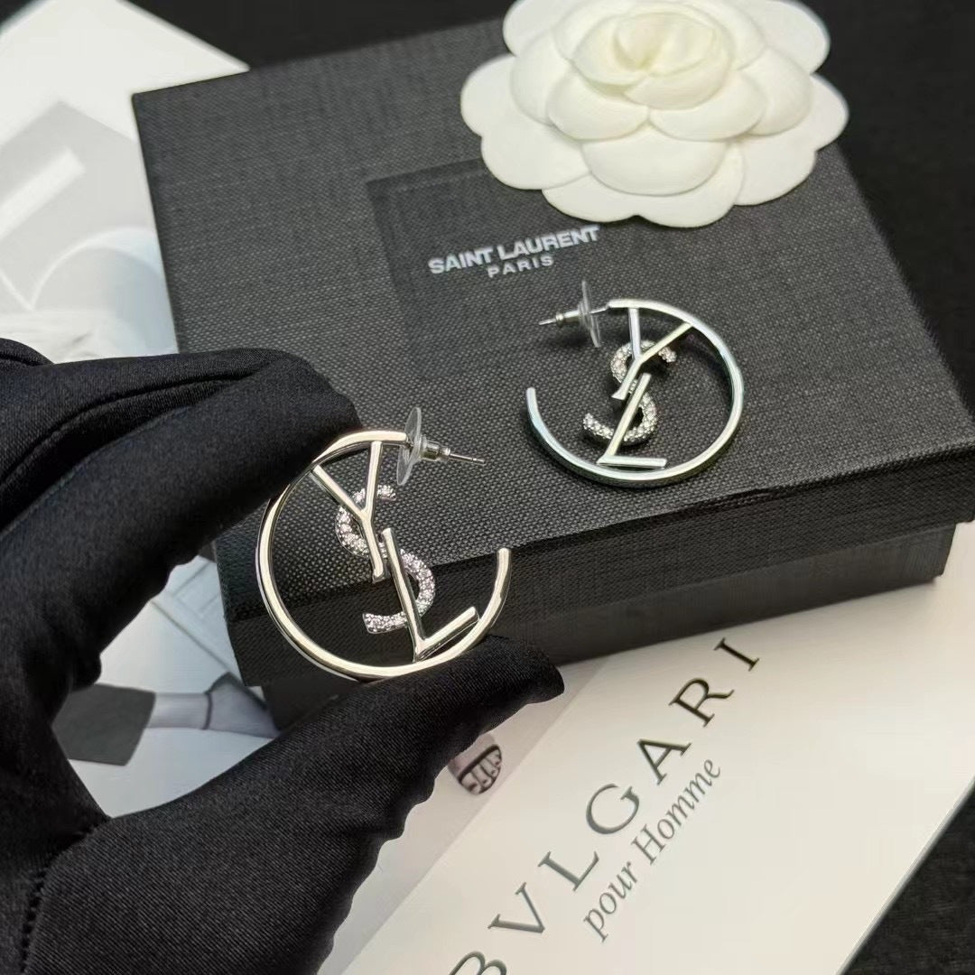 YSL 26S CRYSTAL LOGO HOOP EARRINGS IN SILVER TONE METAL 629137