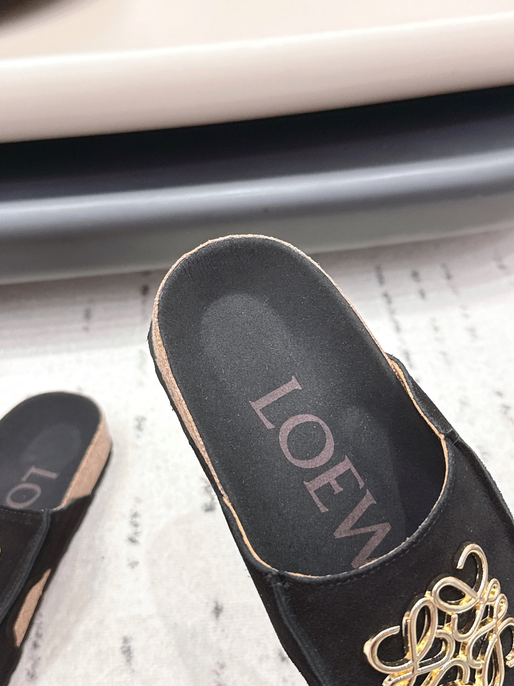 LOEWE 26S FLAT SANDALS IN BLACK LOGO GOLD HARDWARE