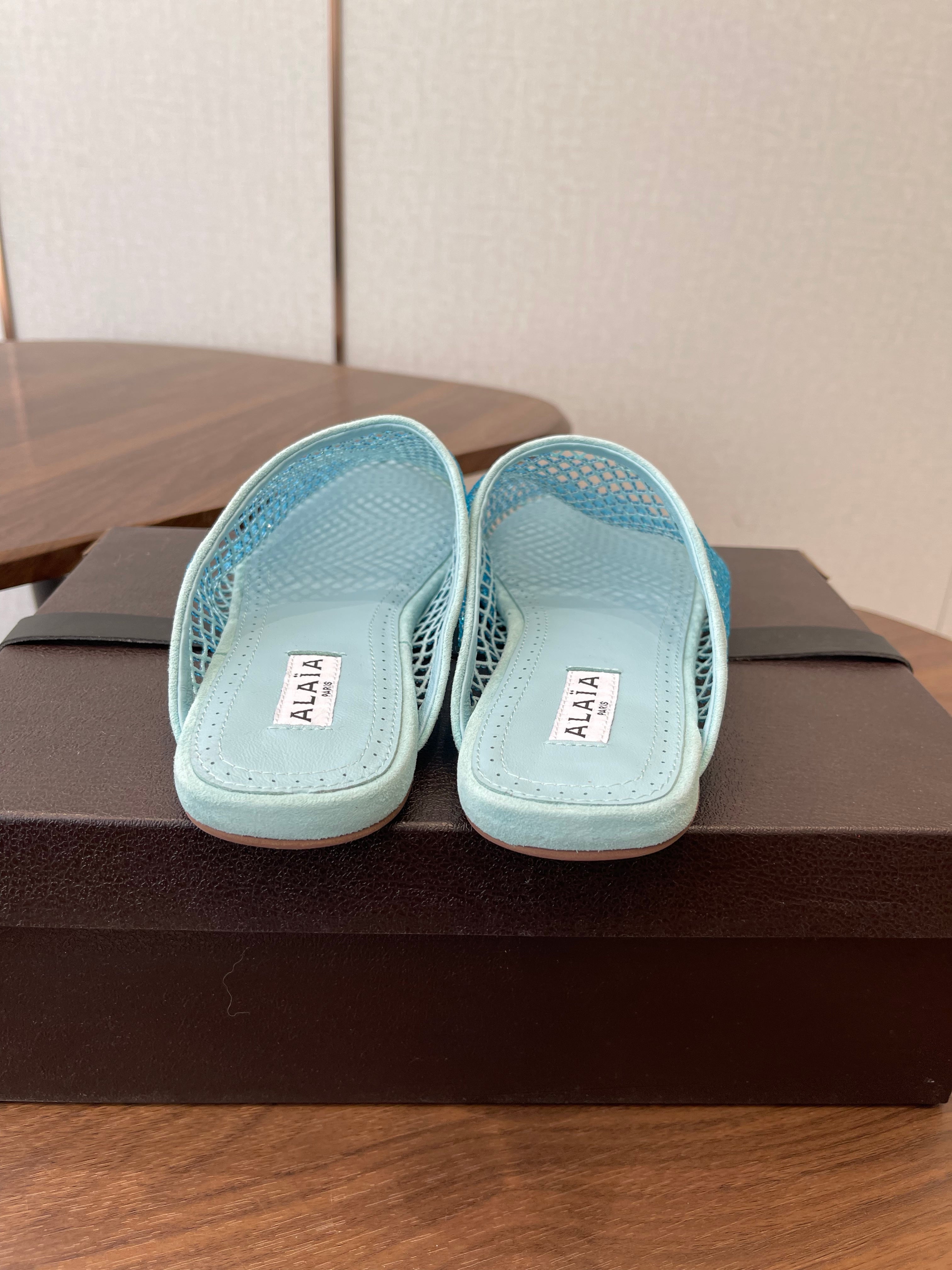 ALAIA 26S FLAT MULES IN BLUE SUEDE AND MESH RHINESTONE-EMBELLISHED