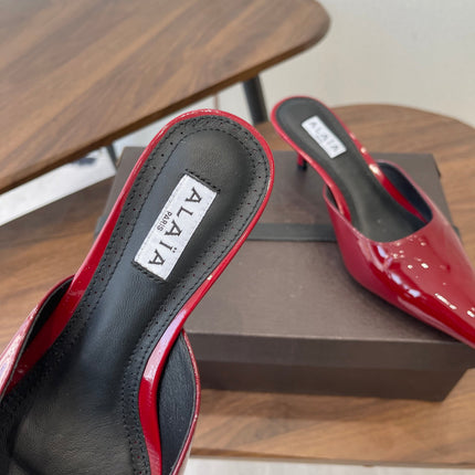 ALAIA 26S HEELED MULES 50 MM IN DARK RED GLOSSY CALFSKIN