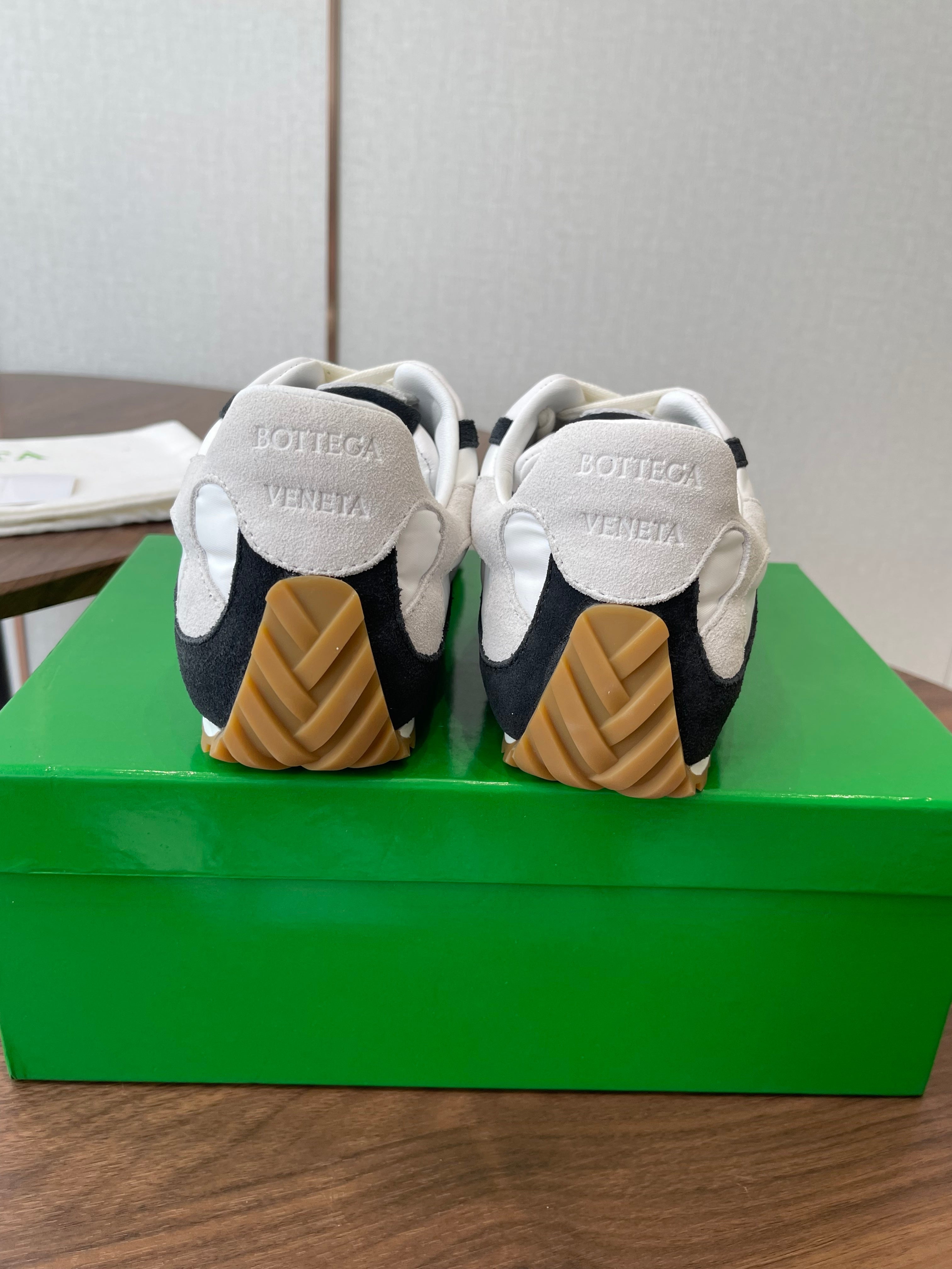 BOTTEGA VENETA 26S ORBIT FLASH SNEAKERS IN WHITE AND BLACK SUEDE