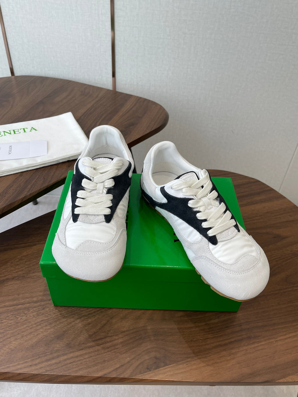 BOTTEGA VENETA 26S ORBIT FLASH SNEAKERS IN WHITE AND BLACK SUEDE