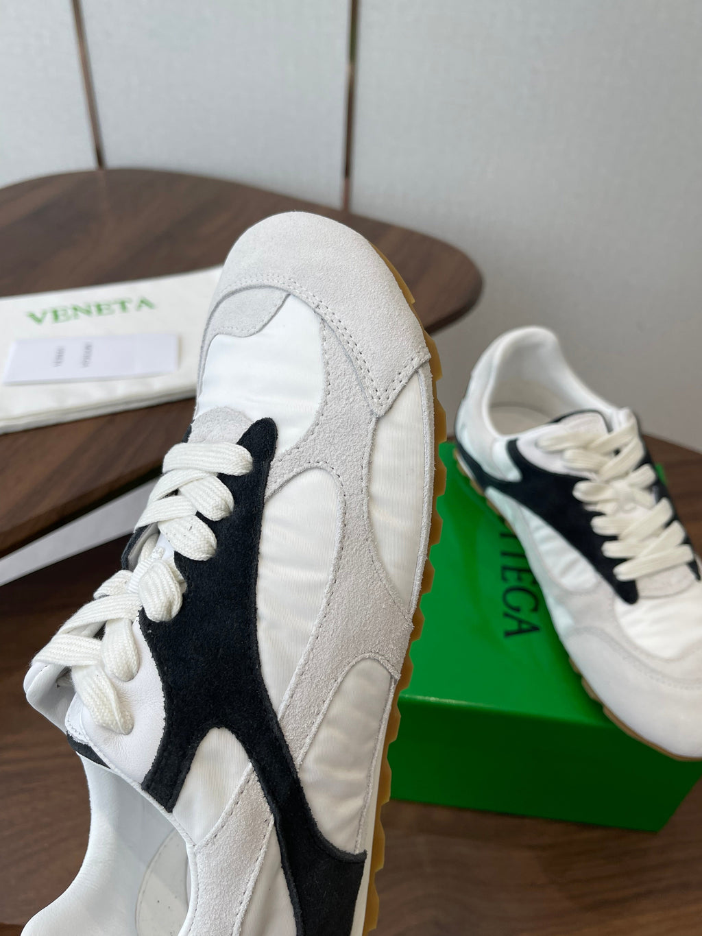 BOTTEGA VENETA 26S ORBIT FLASH SNEAKERS IN WHITE AND BLACK SUEDE