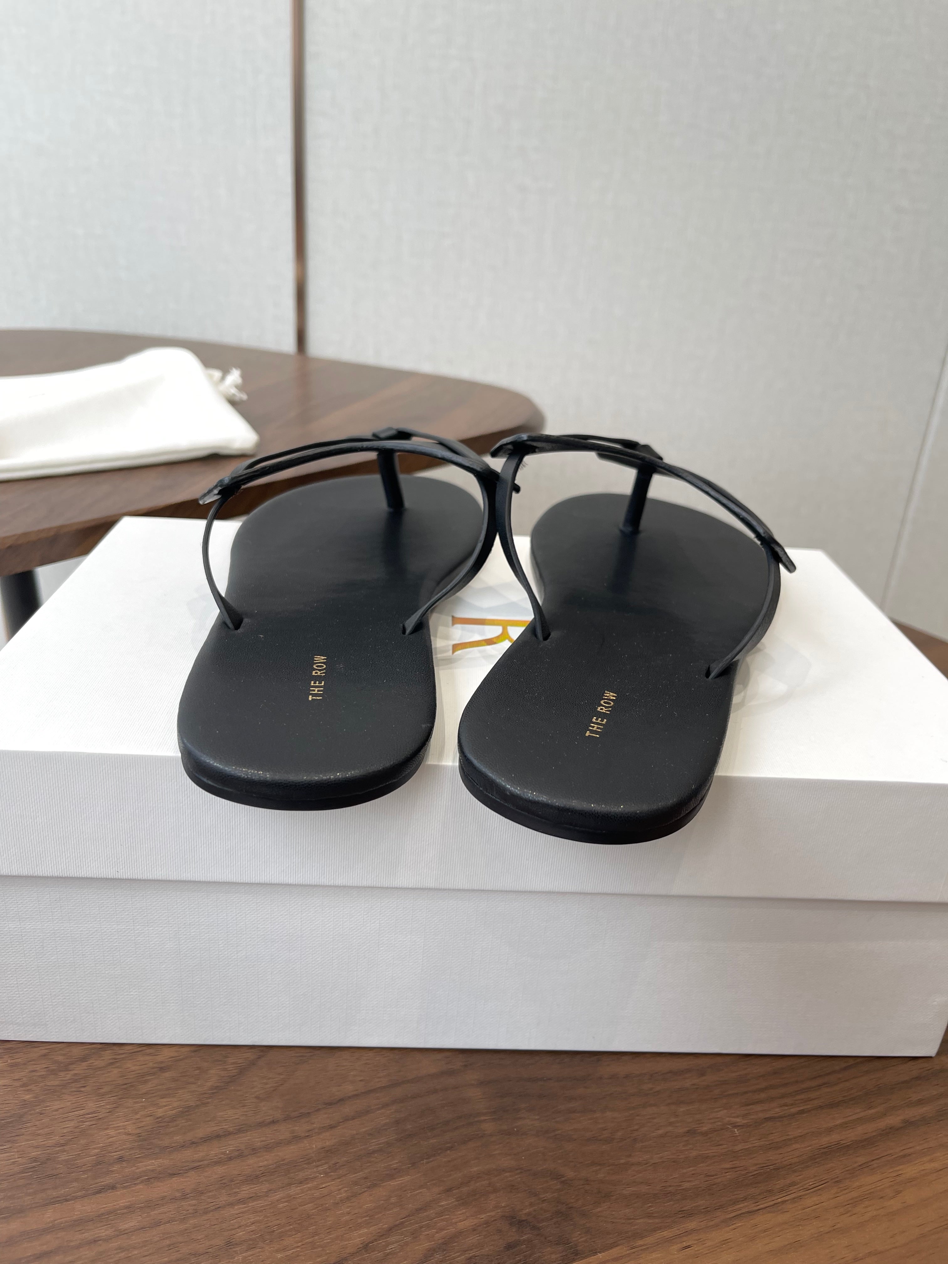 THE ROW 26S T STRAP THONG SANDALS IN BLACK CALFSKIN