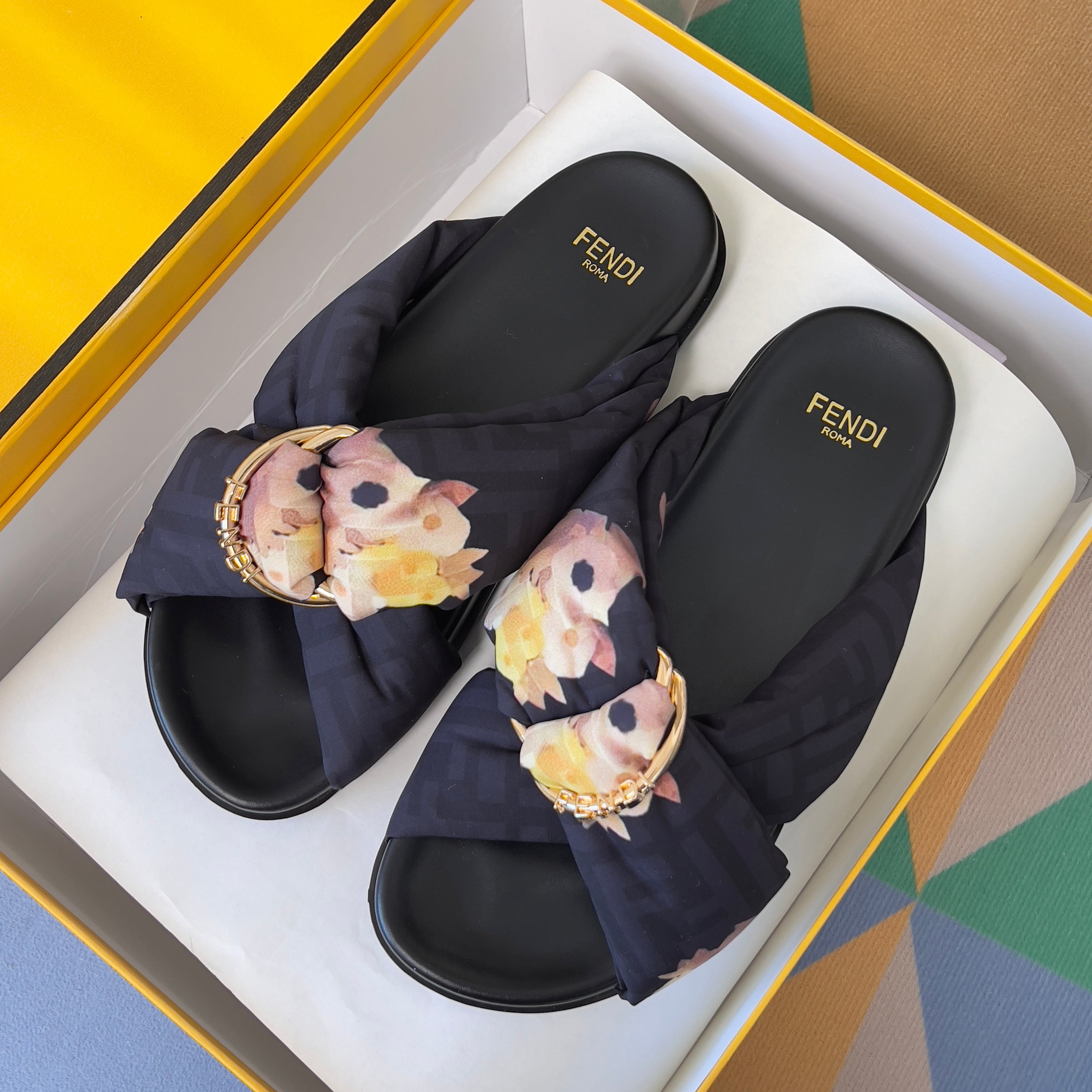 FENDI 26S PATTERNED CROSS-STRAP SLIDE SANDALS IN BLACK FABRIC