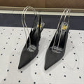 L'ENTRACTE SLINGBACK PUMPS IN BLACK SATIN