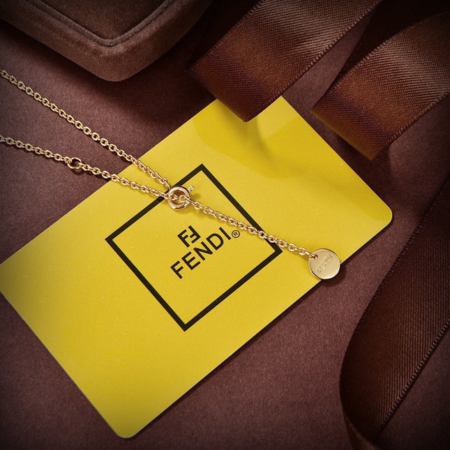 FENDI 26S BAG CHARM PENDANT NECKLACE IN GOLD TONE METAL 625602
