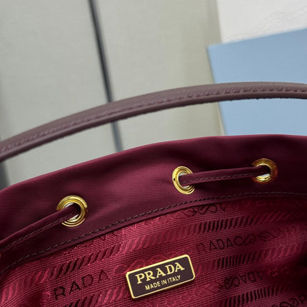 PRADA 25S DUET BUCKET BAG 23 IN BURGUNDY RE-NYLON GOLD HARDWARE