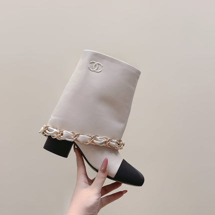 CHANEL 25S CALF-LENGTH BOOTS 45MM IN WHITE AND BLACK CALFSKIN GOLD HARDWARE