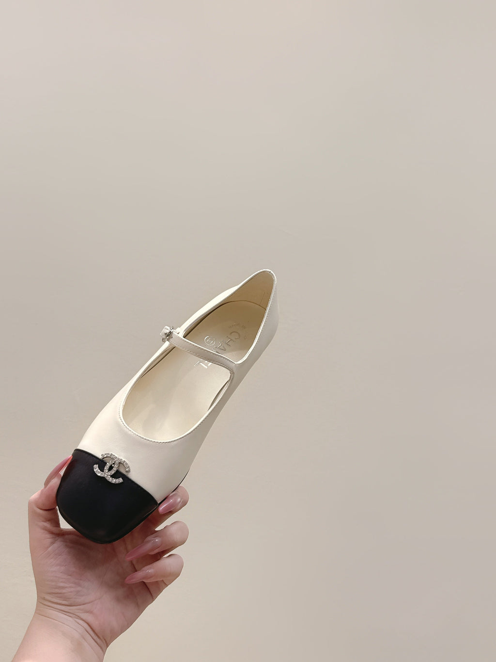 CHANEL 25S MARY JANE FLATS IN IVORY LAMBSKIN WITH BLACK CAP TOE SILVER HARDWARE