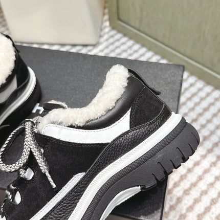 CHANEL 25S THICK-SOLE SNEAKERS IN BLACK AND WHITE CALFSKIN WITH FUR LINING