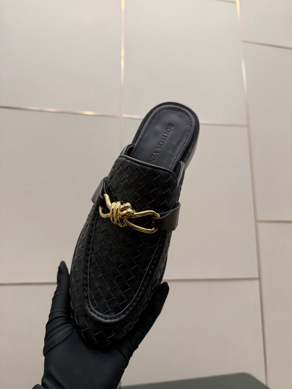 BOTTEGA VENETA 26S BACKLESS LOAFERS IN BLACK TECHNICAL WOVEN CALFSKIN
