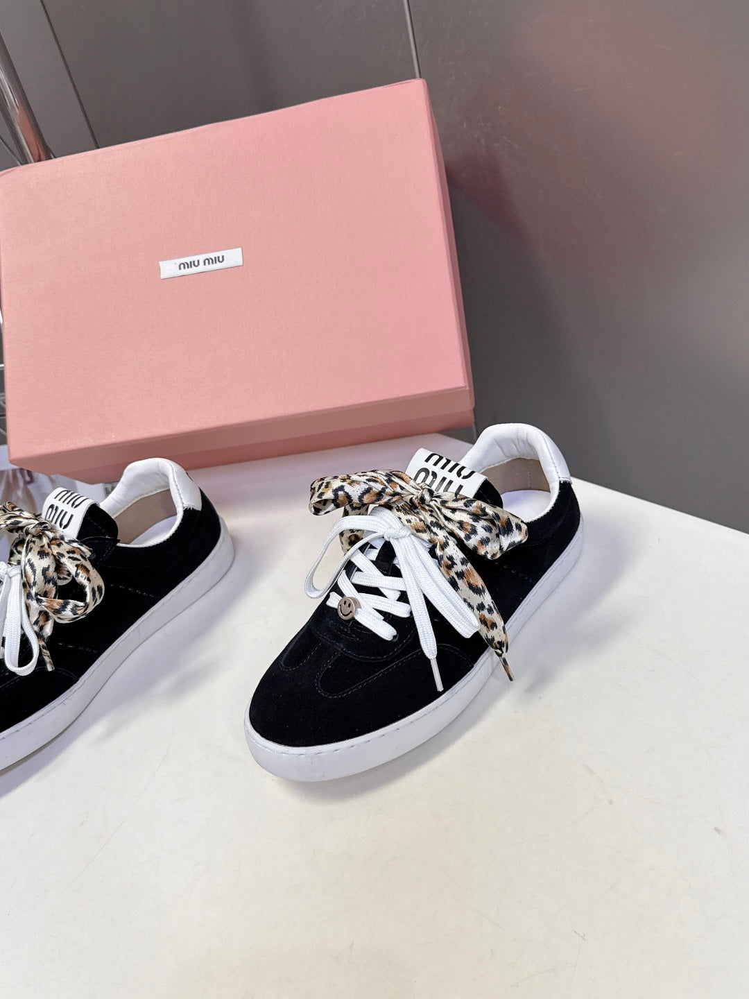 MIUMIU 25S SNEAKERS IN BLACK SUEDE WITH LEOPARD-PRINT LACES