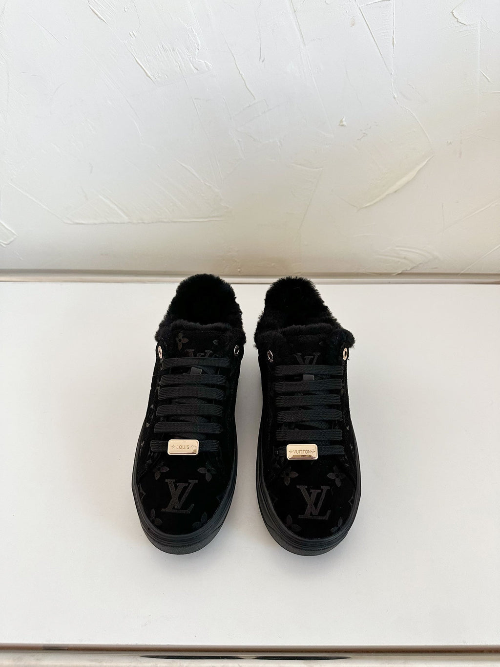TIME OUT SNEAKER IN BLACK MONOGRAM EMBOSSED SUEDE WITH FLEECE LINING