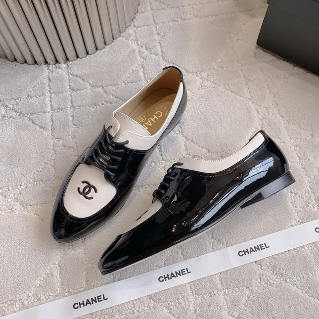 CHANEL 25S TWO TONE LACE UP IN BLACK AND WHITE SHINY CALFSKIN