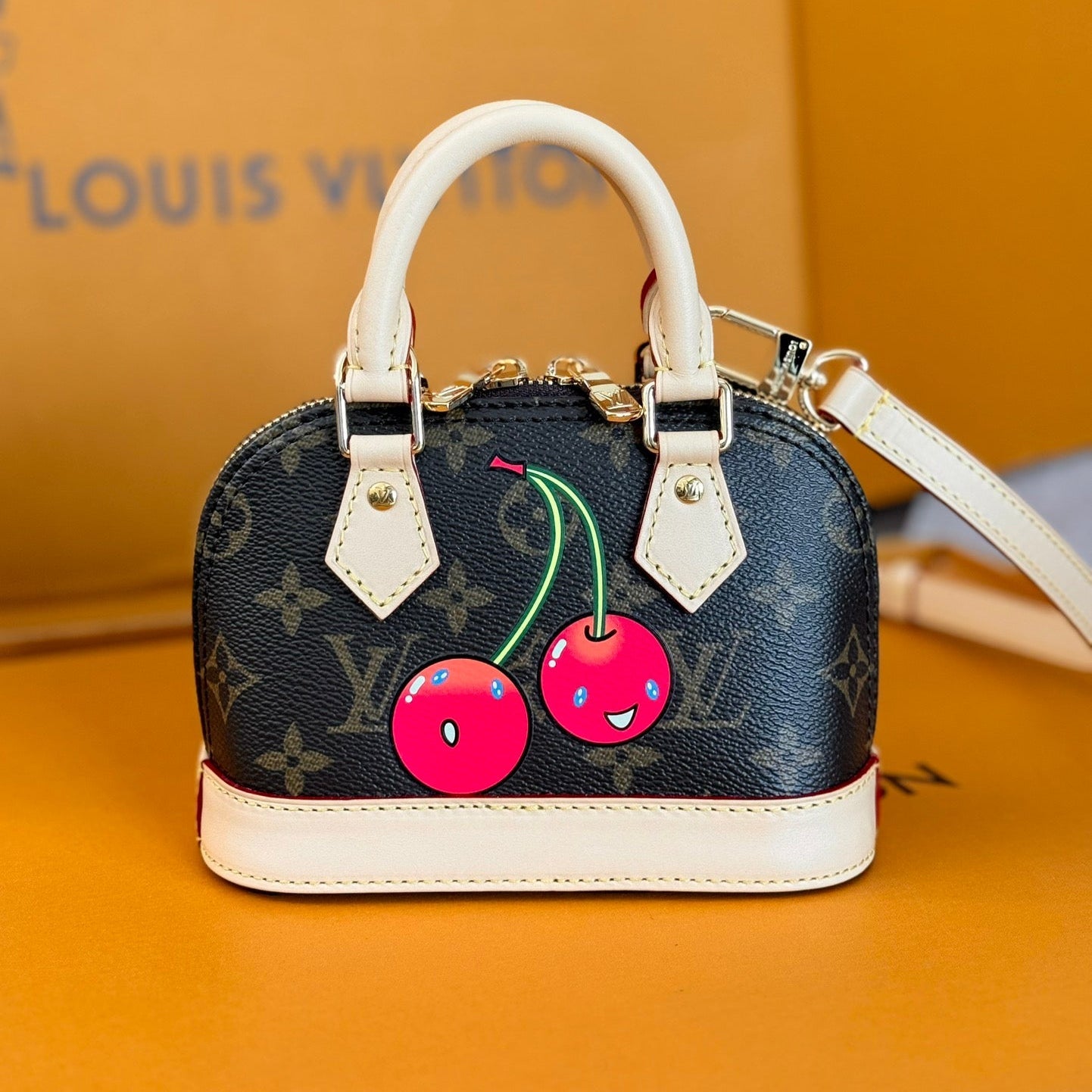 LV 25S NANO ALMA 18 IN DARK BROWN CANVAS MONOGRAM CHERRY PRINT GOLD HARDWARE