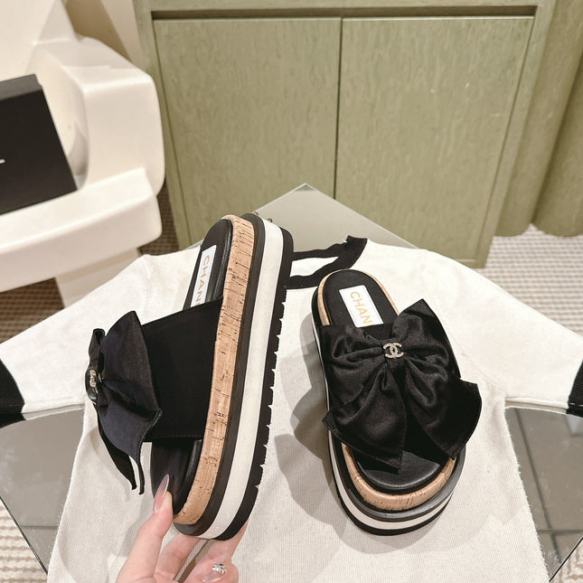 CC SLIPPERS WITH SILK BOW IN BLACK COWHIDE