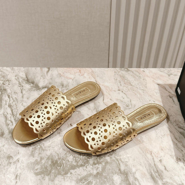 ALAIA PERFORATED SLIDE SANDALS 25S IN LIGHT GOLD LAMBSKIN