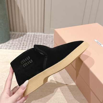 MIUMIU 25S SLIP-ON BOOTIES IN BLACK SUEDE WITH FAUX SHEARLING