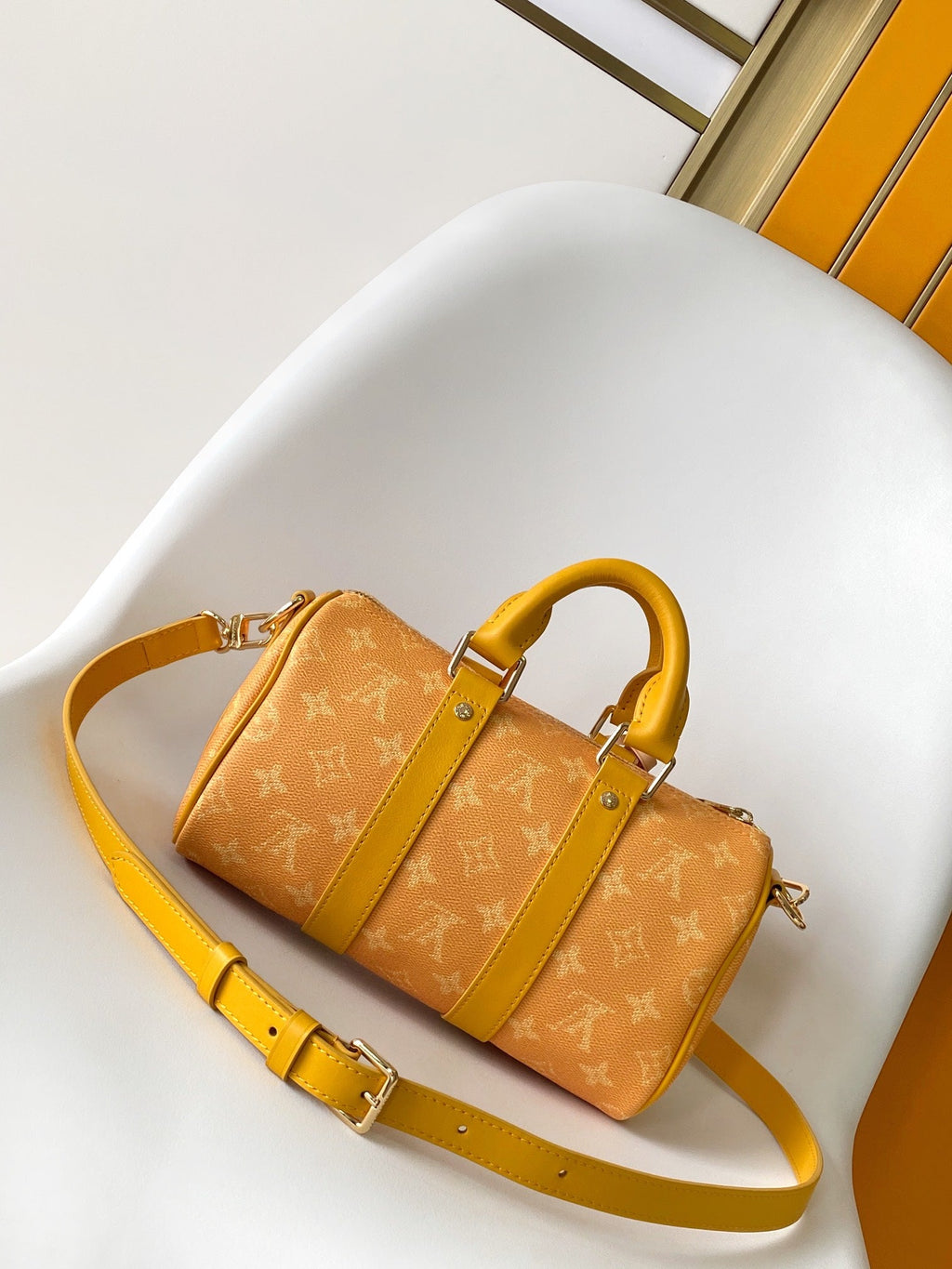 KEEPALL BANDOULIÈRE 25 IN ORANGE MONOGRAM HERITAGE CANVAS