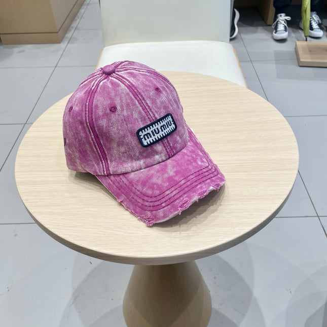MIUMIU DISTRESSED FABRIC BASEBALL CAP IN PINK WITH EMBROIDERED LOGO