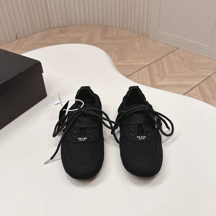 PRADA 26S LACE UP MINIMAL SNEAKERS IN BLACK CANVAS