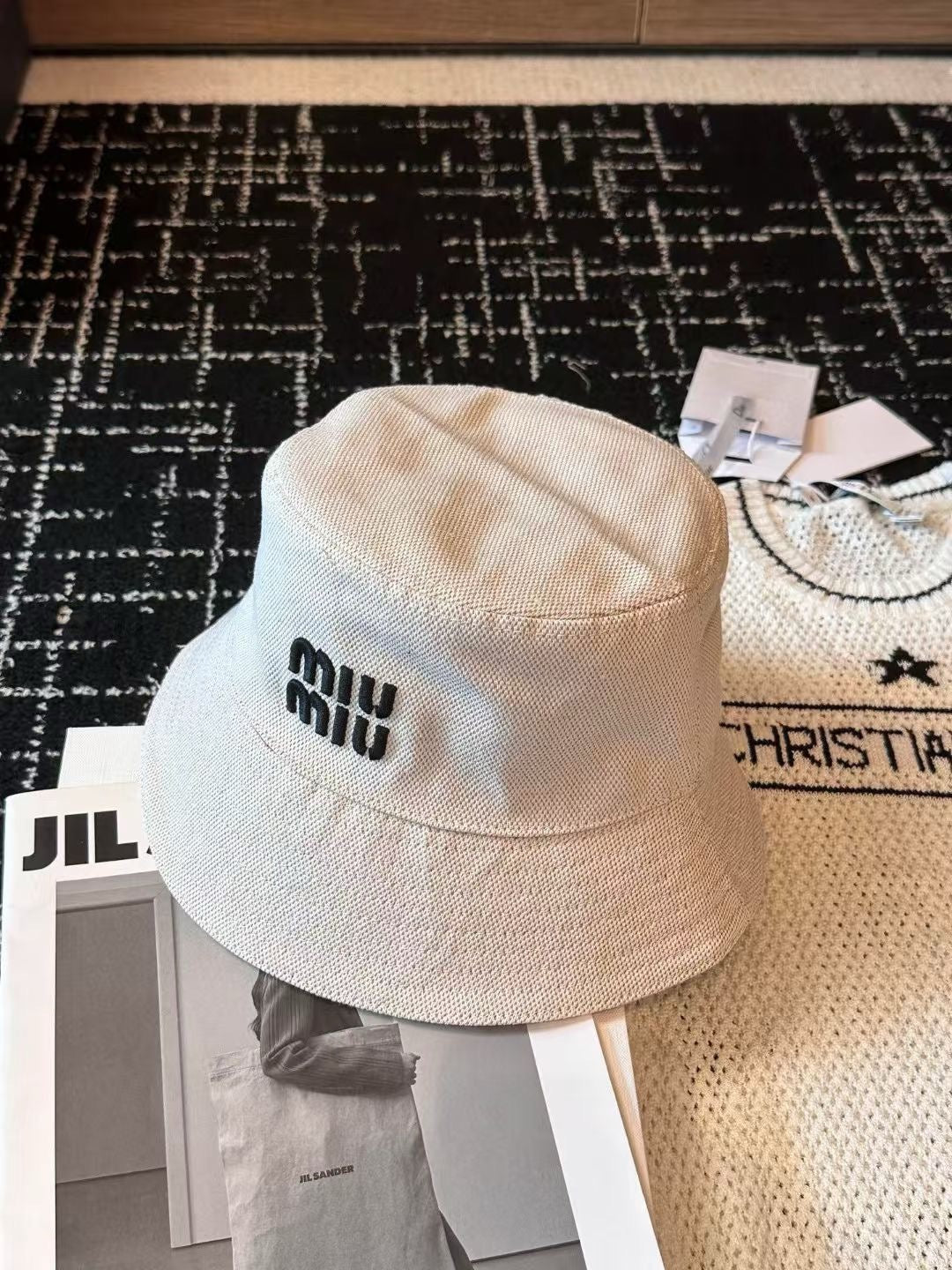 MIUMIU CLASSIC REVERSIBLE BUCKET HAT IN LIGHT BEIGE AND BLACK FABRIC