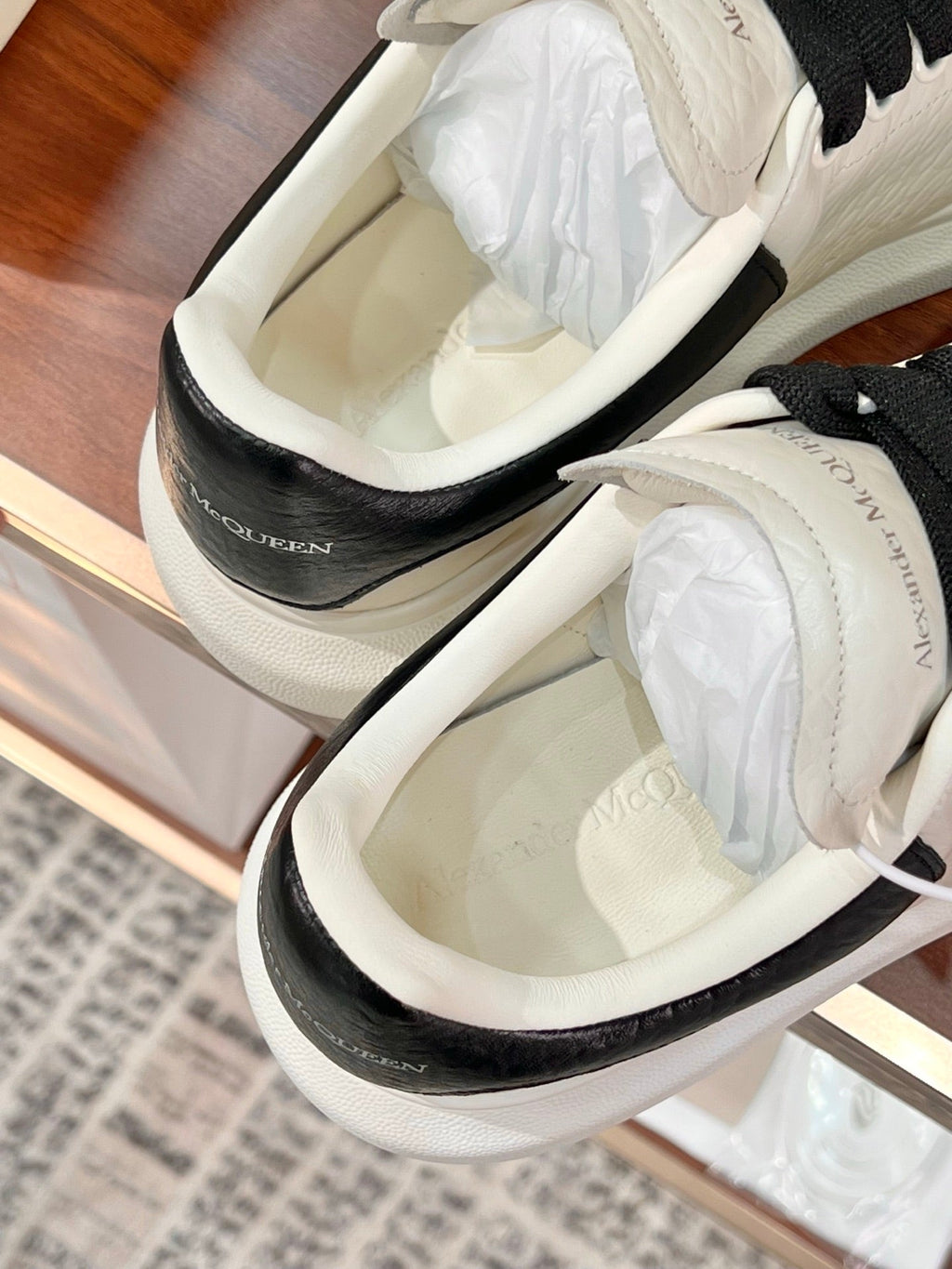 OVERSIZED SNEAKERS IN WHITE CALFSKIN BLACK HEEL BLACK LACES