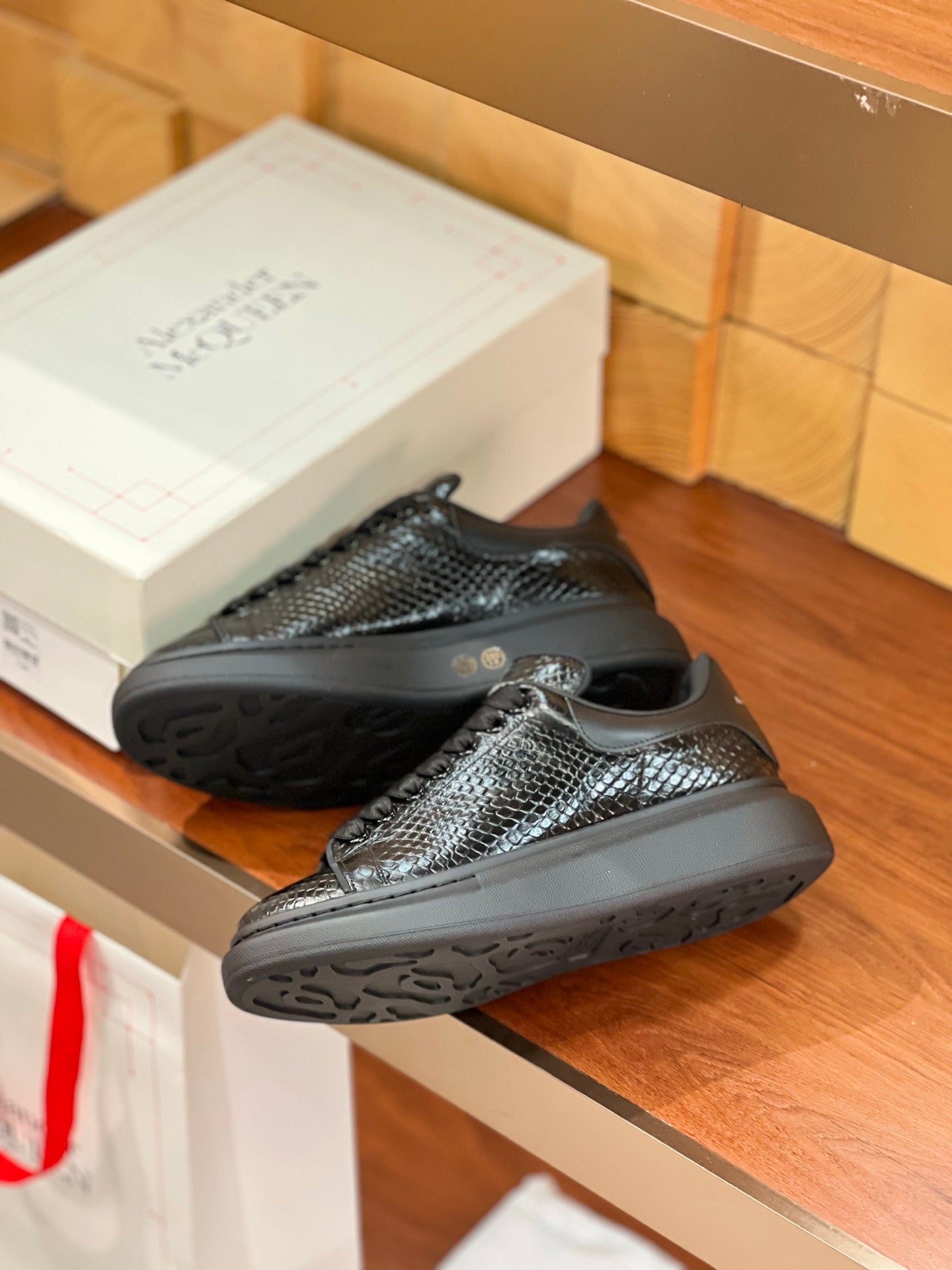 OVERSIZED SNEAKERS IN BLACK GLOSSY CALFSKIN SNAKE-EFFECT