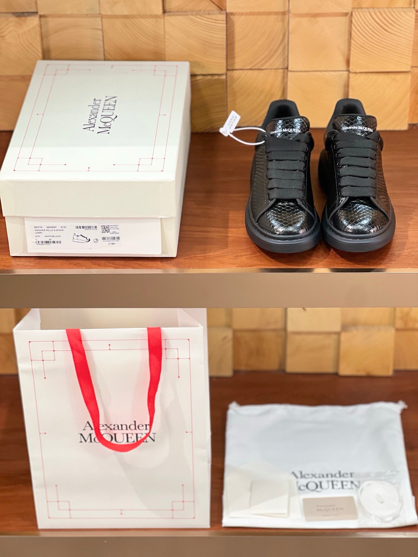 OVERSIZED SNEAKERS IN BLACK GLOSSY CALFSKIN SNAKE-EFFECT
