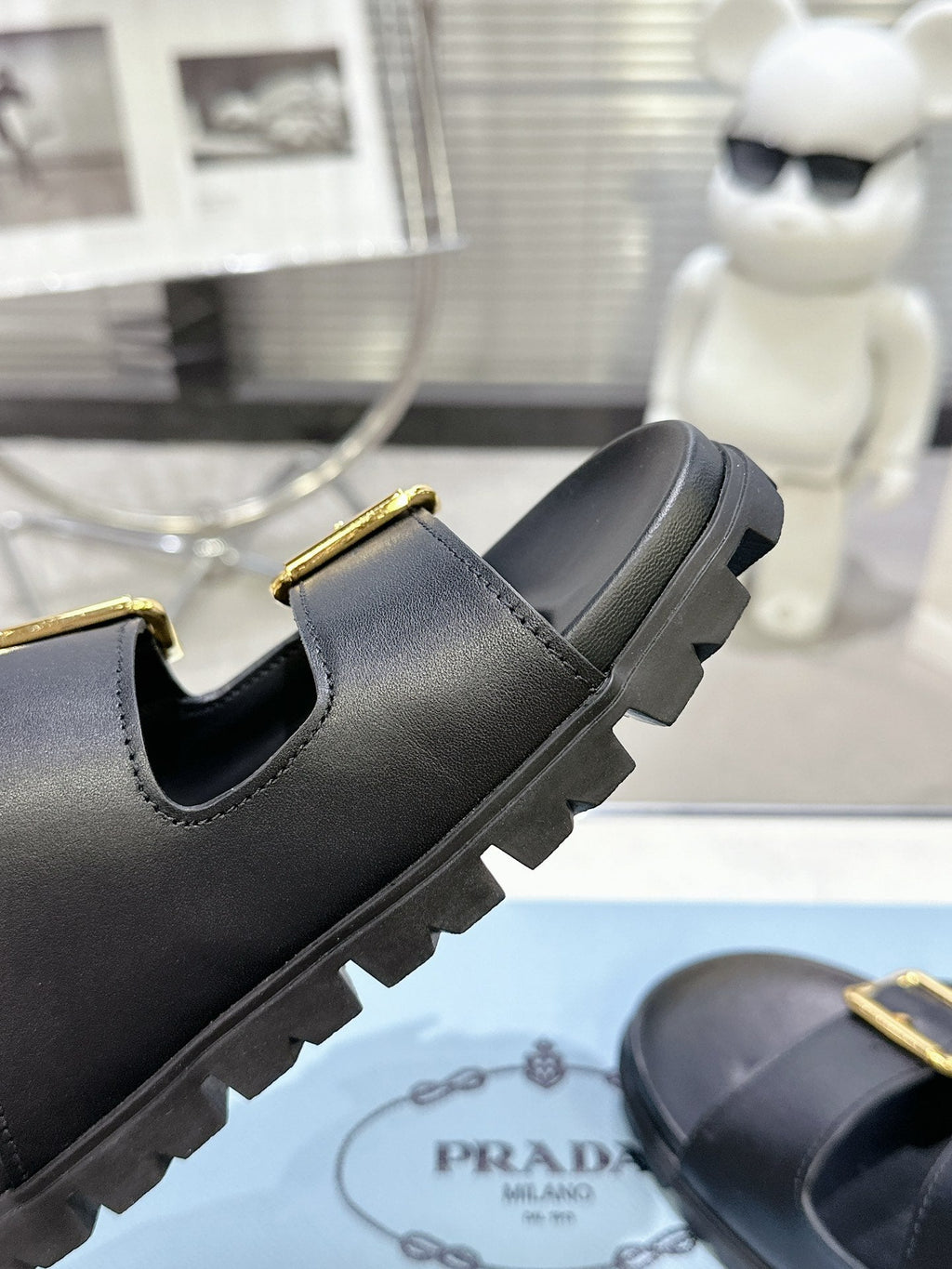 PRADA 25S STRAP SLIDES 30MM IN BLACK CALFSKIN GOLD HARDWARE